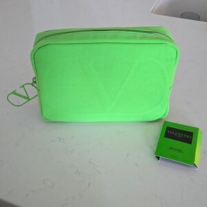 New never used Valentino pouch clutch  9x6 in vibrant spring color VLogo